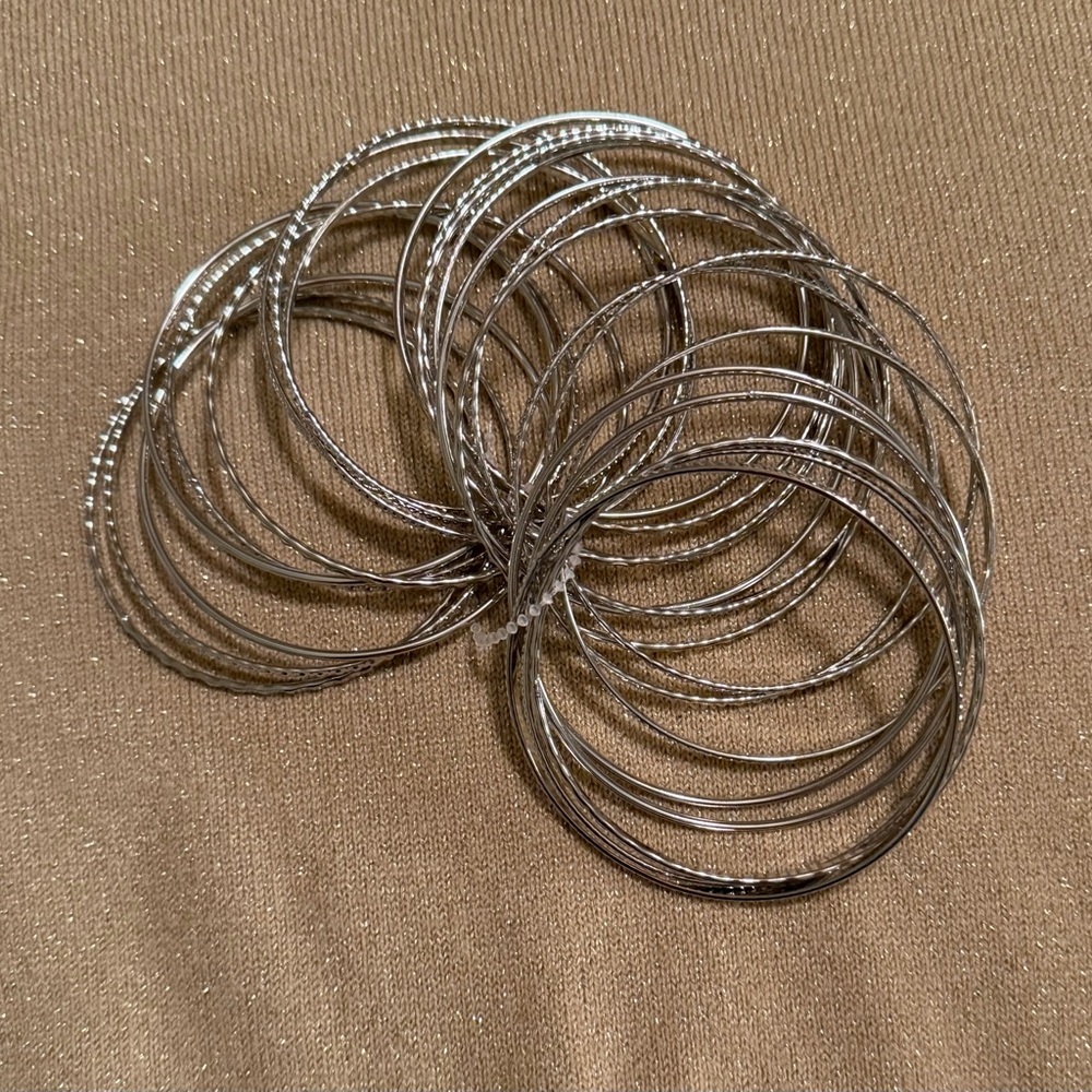 Elegant Silver Bangle Set
3” across 24 rings